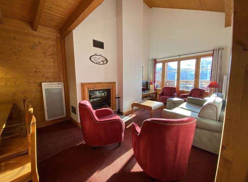 Cozy living room with a fireplace and comfortable seating.