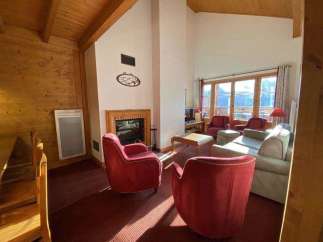 Cozy living room with a fireplace and comfortable seating.