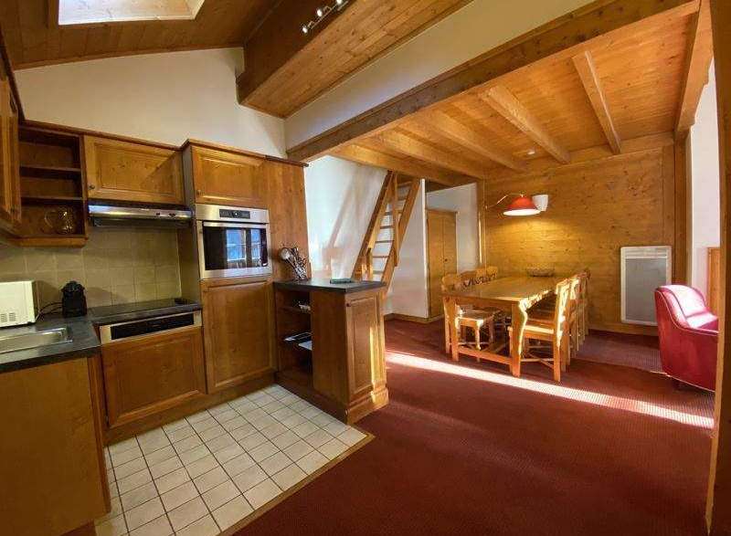 This charming property boasts a cozy kitchen with wooden cabinetry and modern appliances.