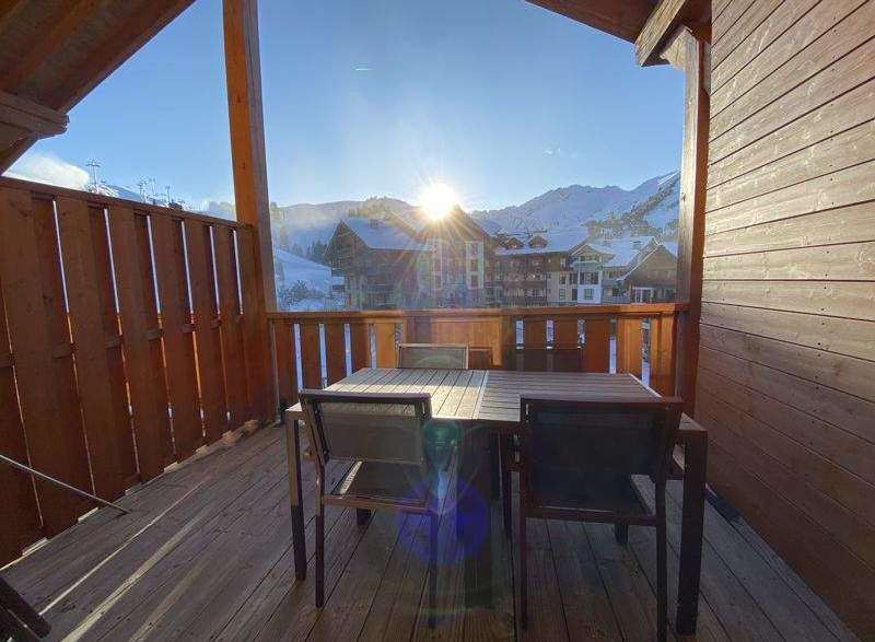 Enjoy breathtaking mountain views from this charming balcony.