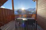 Enjoy breathtaking mountain views from this charming balcony.