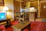 Cozy apartment with a rustic charm, featuring a fully equipped kitchen and a comfortable living area.