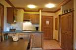 Cozy kitchen with wooden cabinets and a dining area.