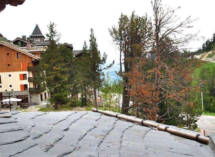 Discover the charm of this property with its stunning slate roof and picturesque mountain views.