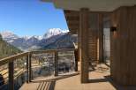 Experience breathtaking mountain views from this luxurious balcony.