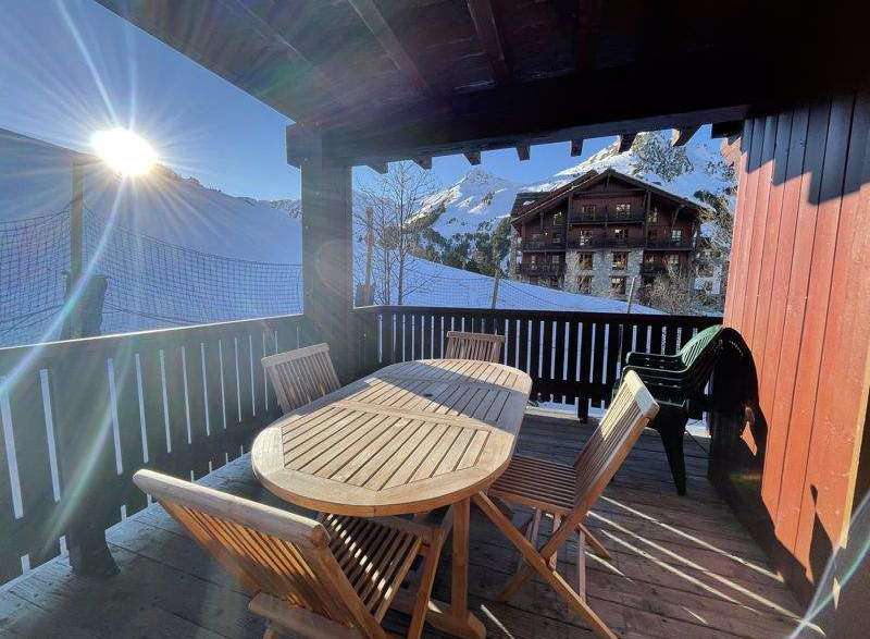 Enjoy breathtaking mountain views from this charming balcony.
