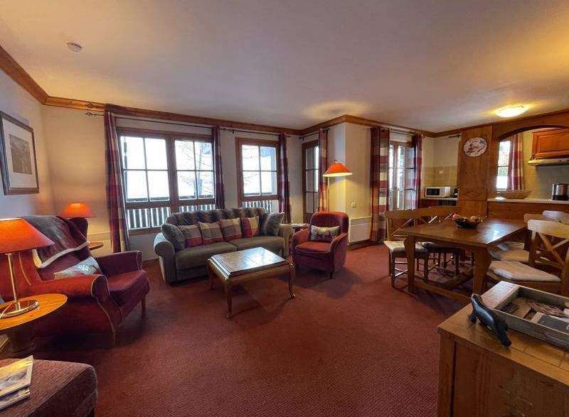 Cozy living space with a comfortable sofa and armchairs, perfect for relaxing after a day of exploring.