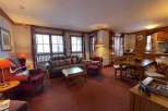 Cozy living space with a comfortable sofa and armchairs, perfect for relaxing after a day of exploring.
