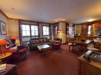 Cozy living space with a comfortable sofa and armchairs, perfect for relaxing after a day of exploring.