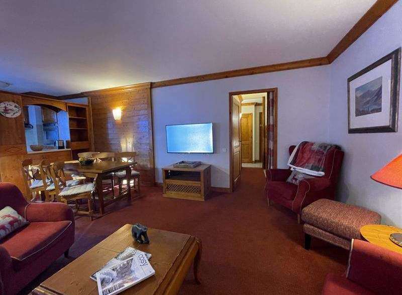 Cozy up in this charming living space! Featuring a dining area, comfortable seating, and a warm ambiance, it's perfect for relaxing.