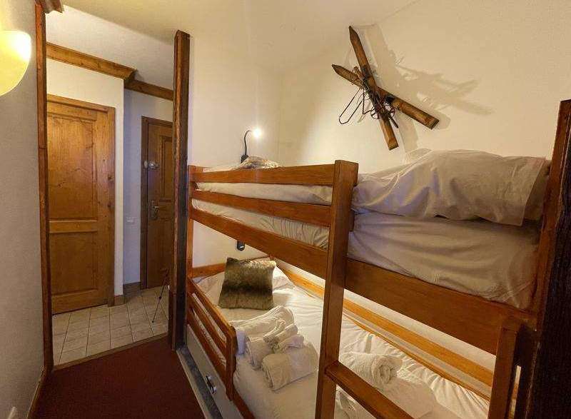 Cozy bunk beds in a charming room, perfect for a family getaway.
