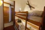 Cozy bunk beds in a charming room, perfect for a family getaway.