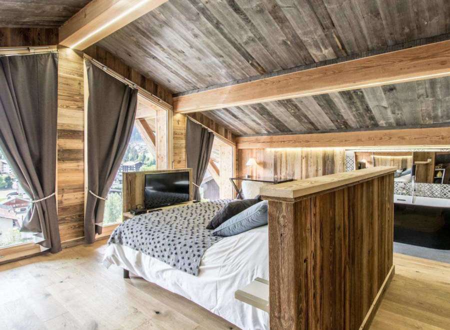 Experience rustic luxury in this stunning bedroom.