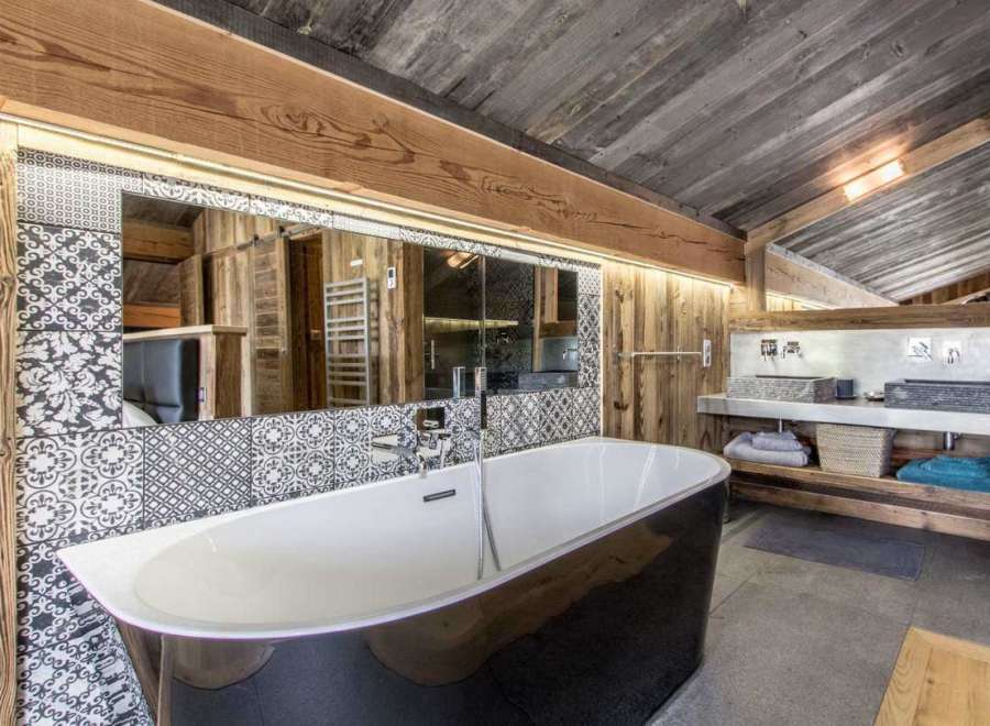 Experience rustic luxury in this stunning bathroom.
