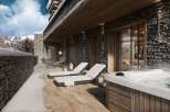 Experience luxury living with this stunning property featuring a private balcony and a relaxing hot tub.