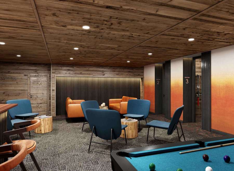 Experience luxury and comfort in this stunning property, featuring a cozy lounge area with stylish seating and a pool table for entertainment.