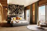 Experience luxury in this stunning bedroom with a unique artistic accent wall.