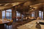 Experience luxury living in this stunning chalet, featuring a cozy fireplace and expansive windows that frame breathtaking snowy views.