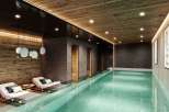 Indulge in the ultimate relaxation experience at this luxurious indoor pool.