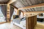 Experience rustic luxury in this stunning bedroom.