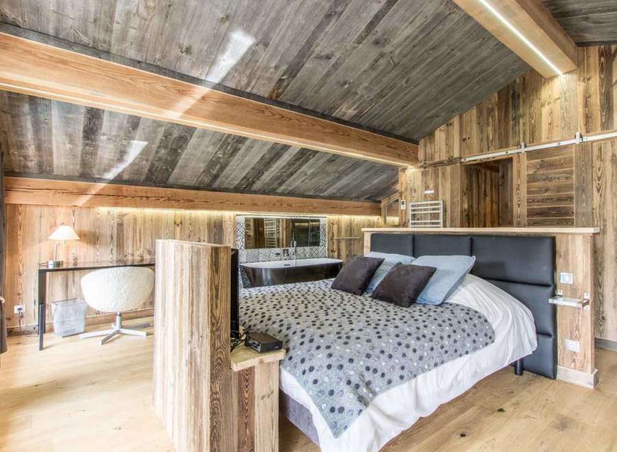 Experience rustic luxury in this stunning bedroom.