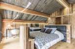 Experience rustic luxury in this stunning bedroom.