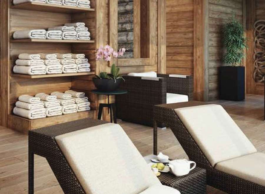 Relax and unwind in our luxurious spa, featuring comfortable lounge chairs and plush towels.