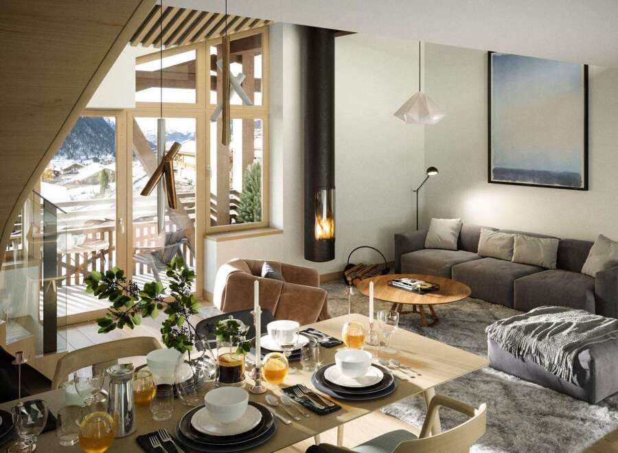 This stunning chalet boasts an open-plan living area with a cozy fireplace, perfect for relaxing after a day on the slopes.