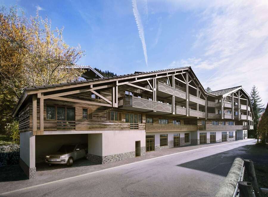 This stunning chalet-style apartment building boasts spacious balconies with intricate metalwork, offering breathtaking views.
