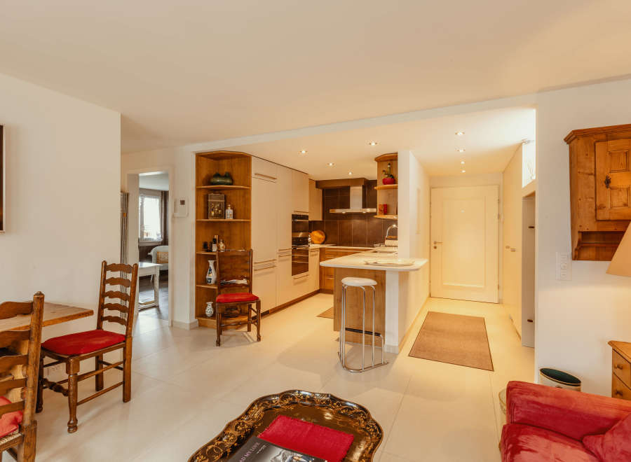 Discover a charming home with a well-designed kitchen and a cozy living area.