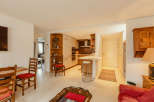 Discover a charming home with a well-designed kitchen and a cozy living area.