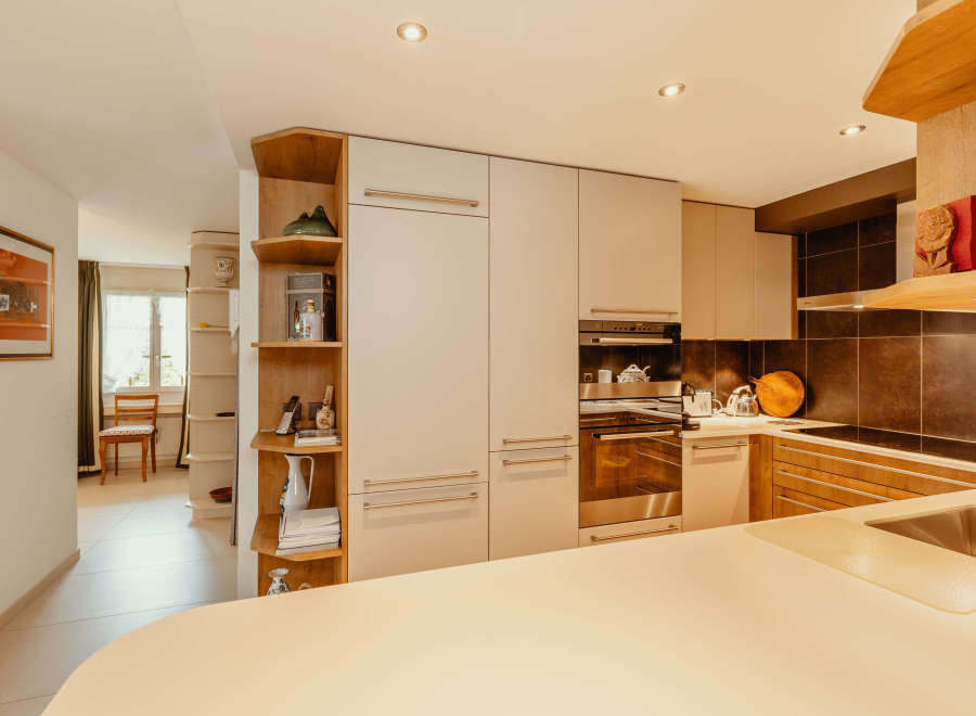 Step into this stunning kitchen, featuring modern cabinetry and sleek stainless steel appliances.