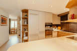 Step into this stunning kitchen, featuring modern cabinetry and sleek stainless steel appliances.