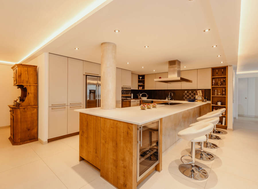 This stunning kitchen boasts a modern design with a spacious island, perfect for entertaining.
