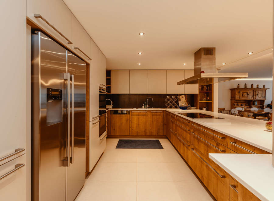 This modern kitchen boasts sleek stainless steel appliances and custom cabinetry.