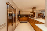 This modern kitchen boasts sleek stainless steel appliances and custom cabinetry.