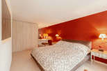 This cozy bedroom features a comfortable bed with a unique patterned duvet.