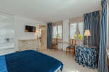 This elegant bedroom features a classic design with a touch of sophistication.