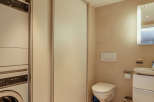 This modern bathroom features a sleek design with neutral tones and ample natural light.