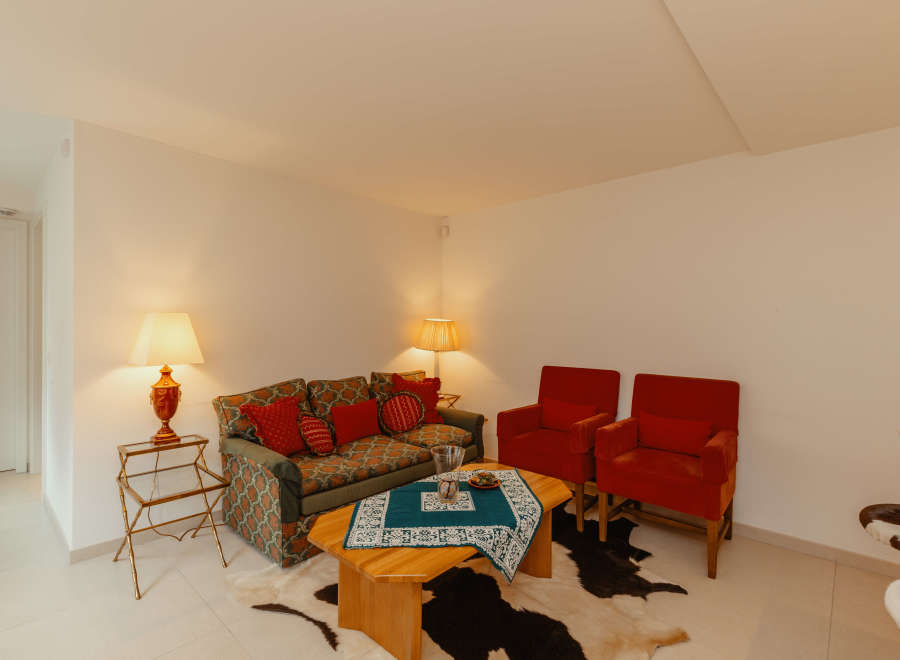 Cozy living room with a stylish sofa and two armchairs.