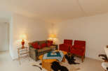 Cozy living room with a stylish sofa and two armchairs.