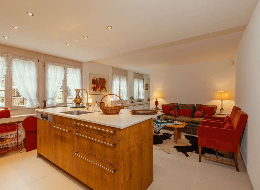 This charming property features a beautifully designed kitchen with a modern island and ample storage.