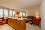 This charming property features a beautifully designed kitchen with a modern island and ample storage.