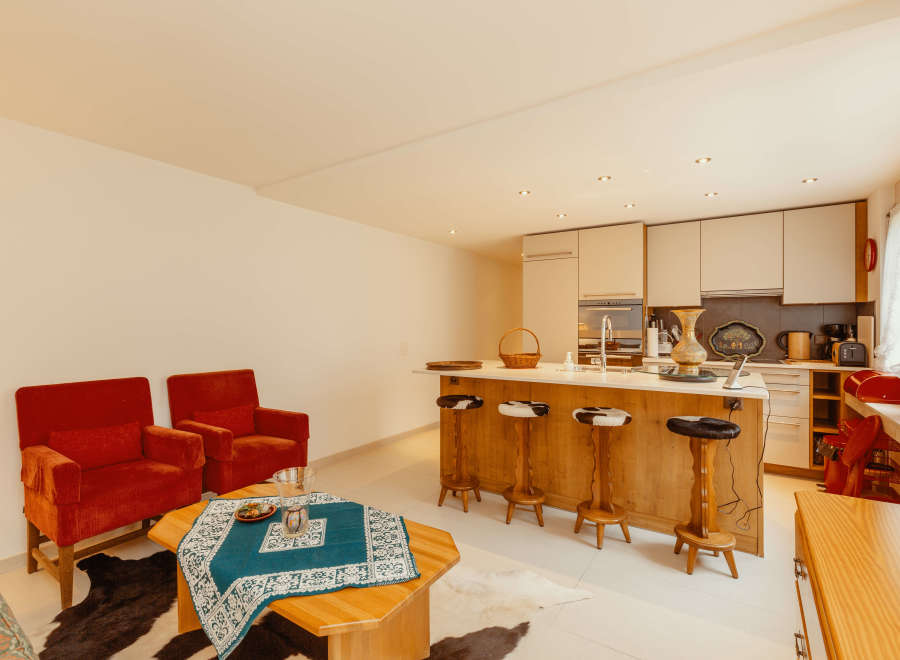 This stunning property boasts a modern kitchen with a stylish island and comfortable seating.