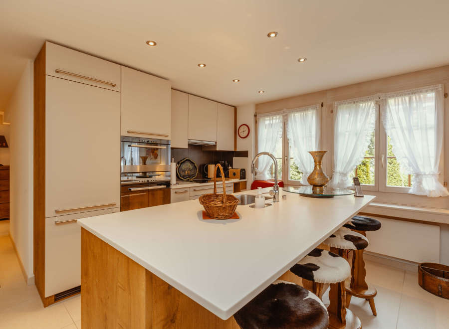 This stunning kitchen boasts a modern design with a spacious island, perfect for culinary creations and casual dining.