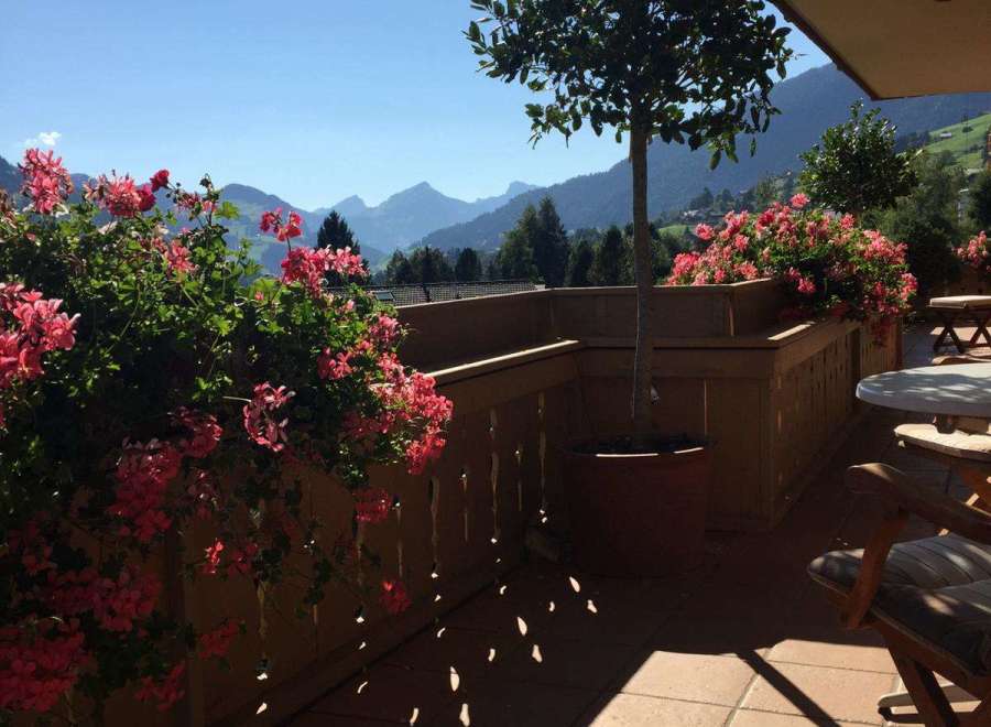 Enjoy breathtaking mountain views from this charming balcony.