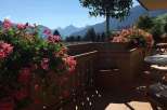 Enjoy breathtaking mountain views from this charming balcony.