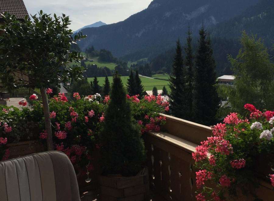 Enjoy breathtaking mountain views from this charming balcony.