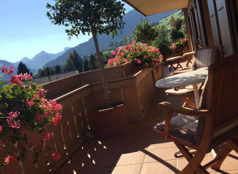 Enjoy breathtaking mountain views from this charming balcony.