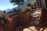 Enjoy breathtaking mountain views from this charming balcony.